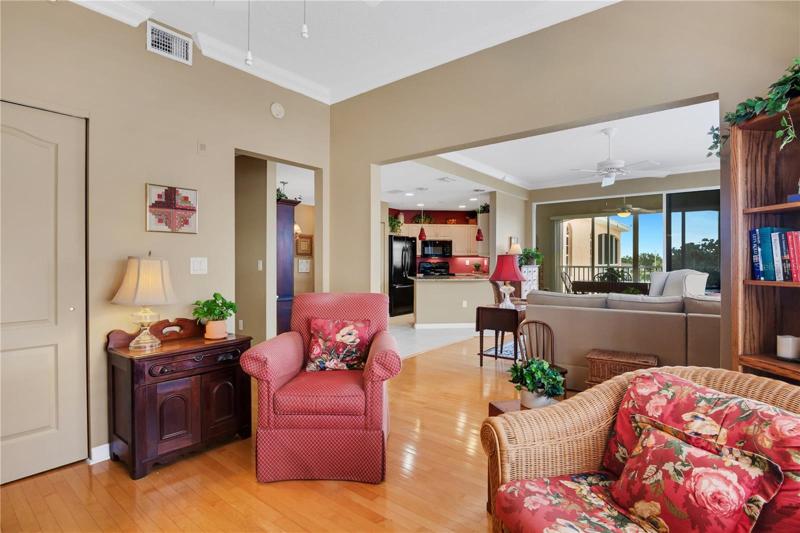 Den showing living room, kitchen and Florida room.