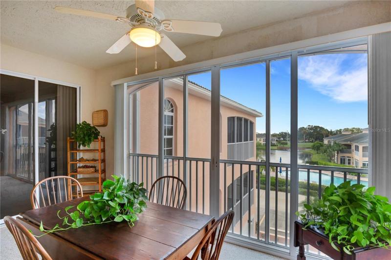 Water view from Florida room. Sliders open up to convert room to a screened lanai allowing cool breezes in.