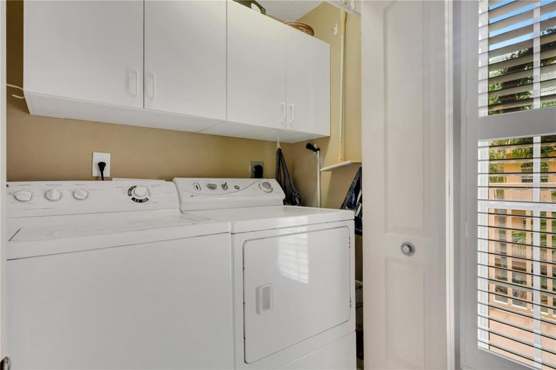 Washer/dryer tucked away by front door
