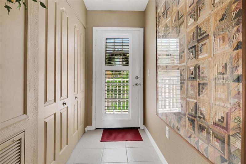 Standing near dinette looking at front door