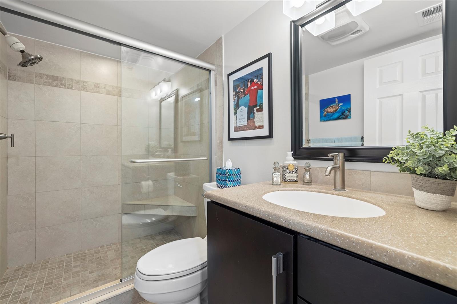 The second bathroom is located just in between the kitchen and the second bedroom