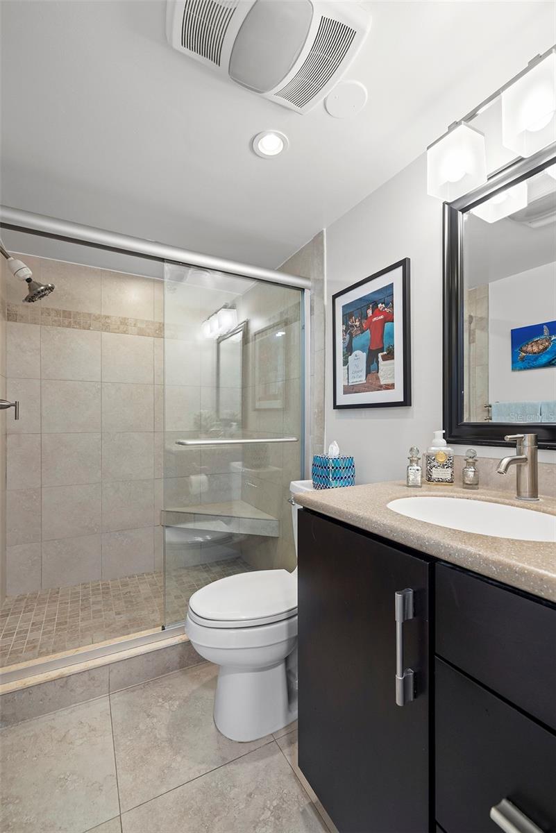 The second bathroom has a walk-in shower for ease