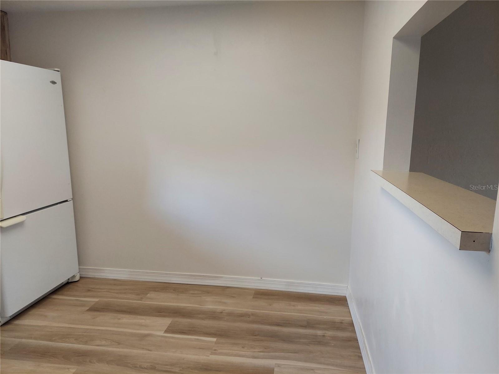 Kitchen is large enough to have a table and two chairs