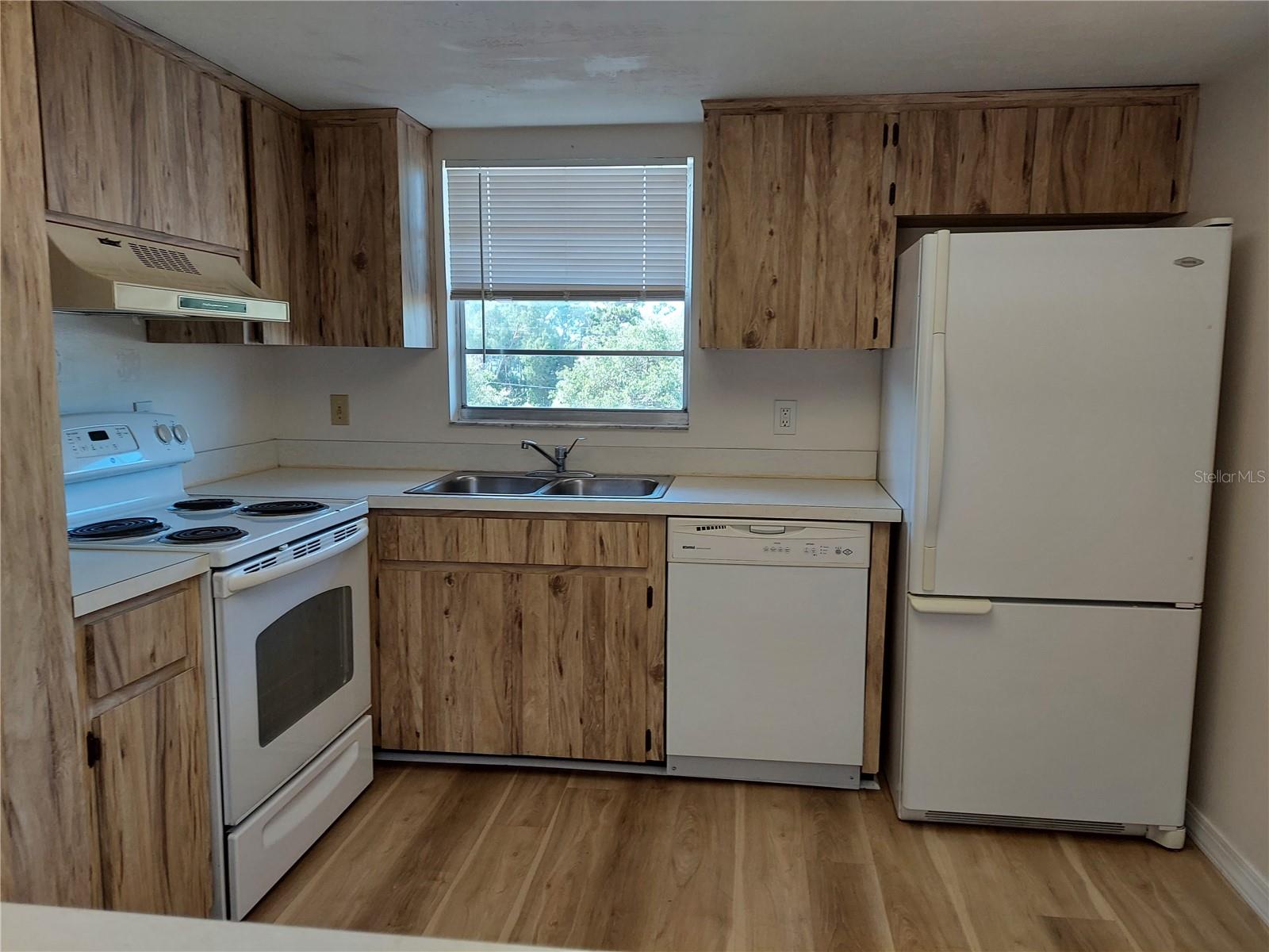 kitchen refrigerator, stove, dishwasher and garbage disposal