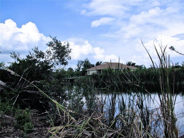 View down the canal to the left of the lot.