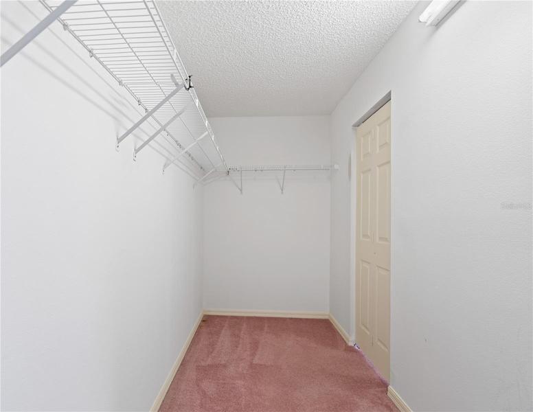 Master walk in closet with two doors