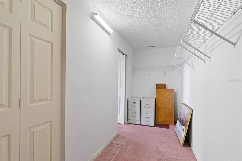 Master walk in closet with two doors