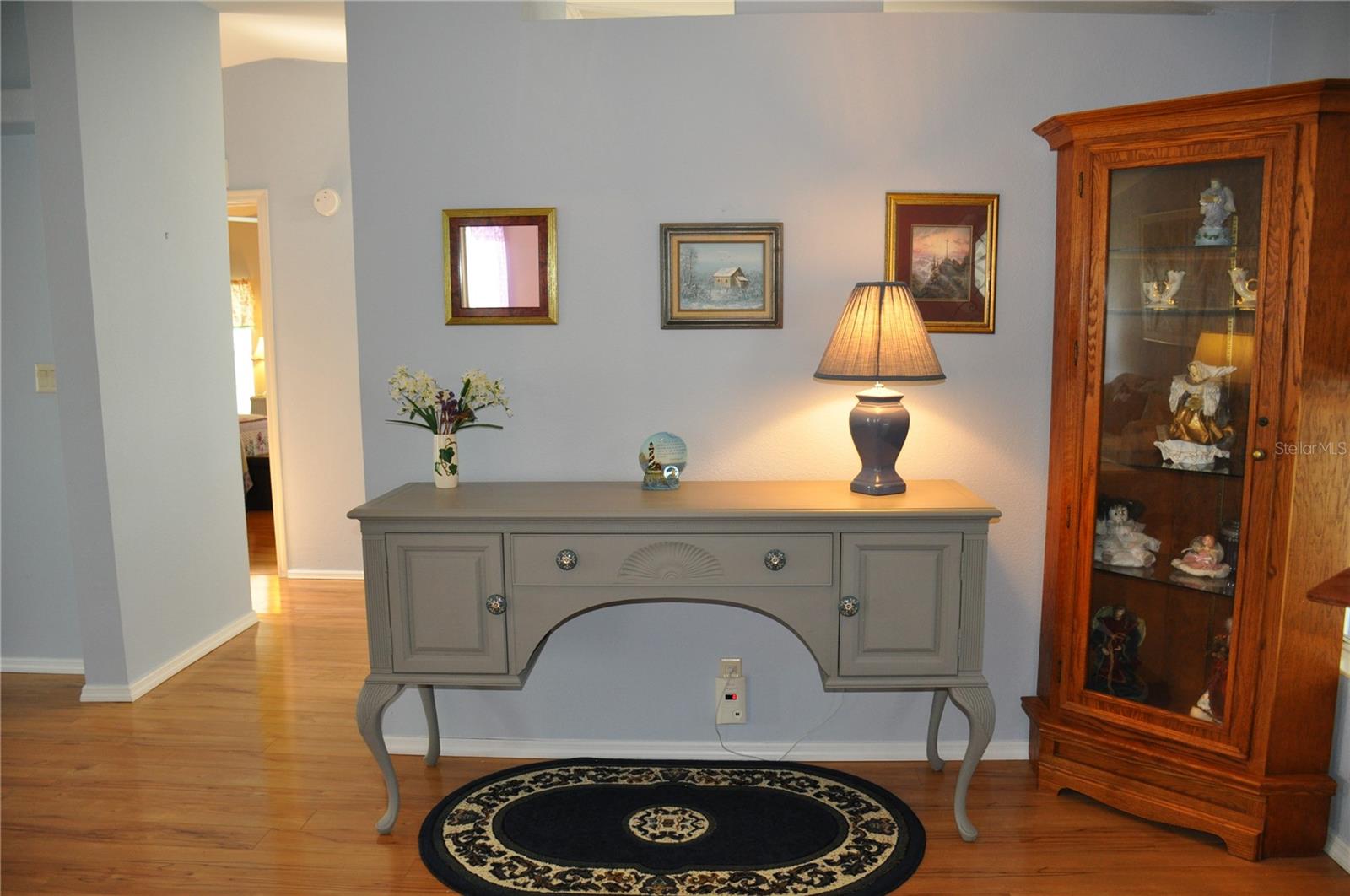 Foyer and hallway leading to kitchen and guest bedroom