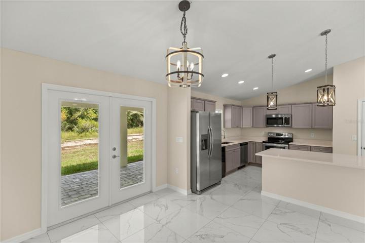 DINING ROOM WITH FRENCH DOOR ACCESS TO LANAI