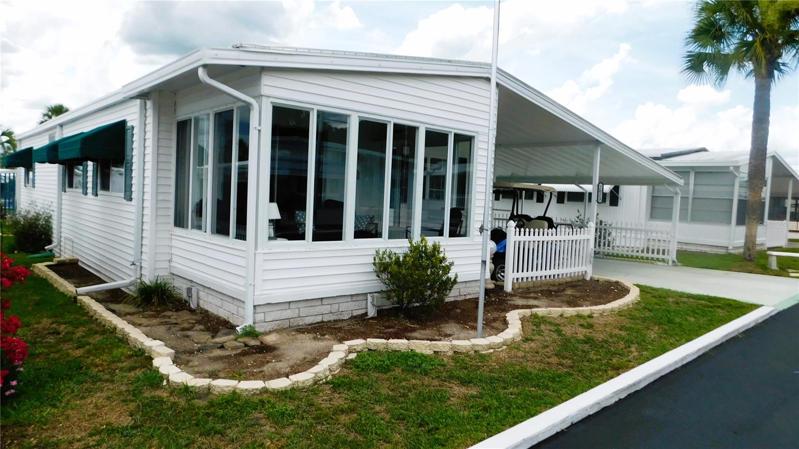 This home has a wonderful front Florida room.