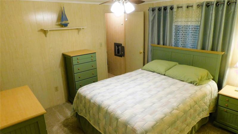 Bedroom #2 has updated ceiling fan, walk-in closet and ample space.