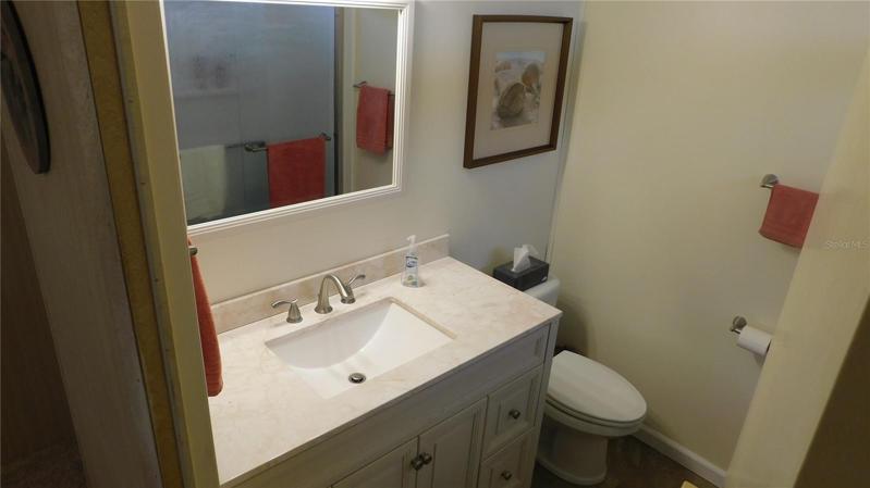 Updated master bathroom includes step-in shower.