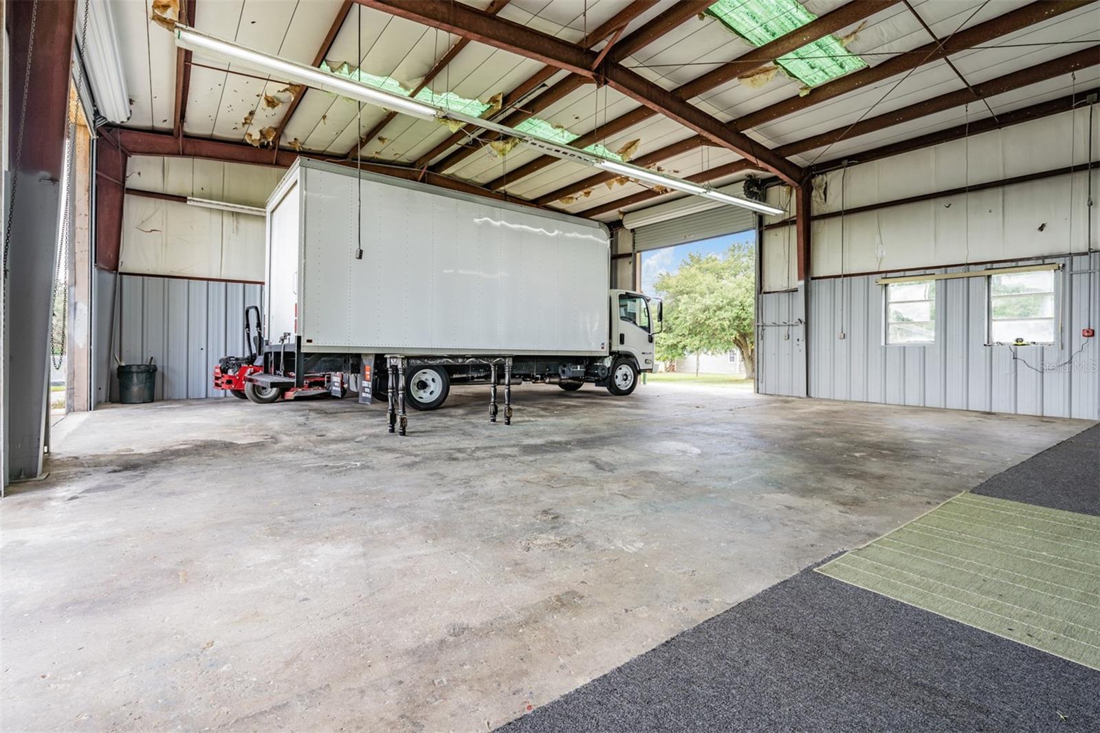 ONE BAY is pull thru with front & rear roll up doors