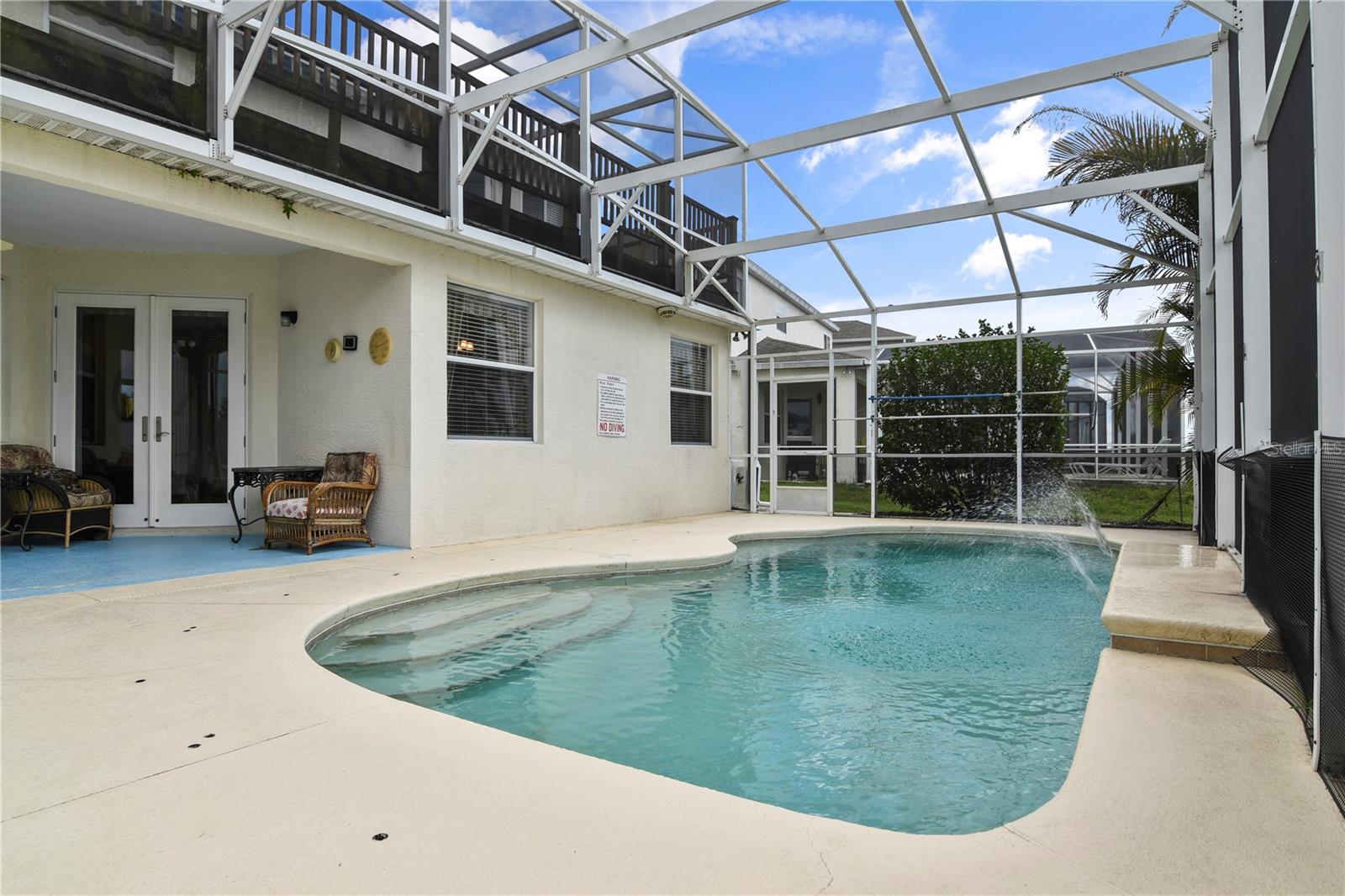 The covered LANAI and SCREENED POOL is the perfect escape and the native landscaping adds to the Florida feel!