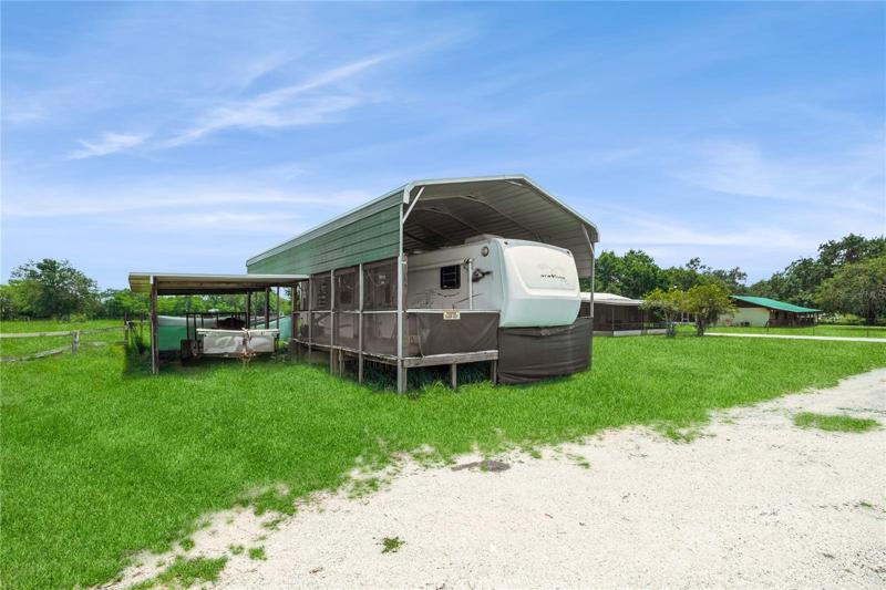 RV with screened carport