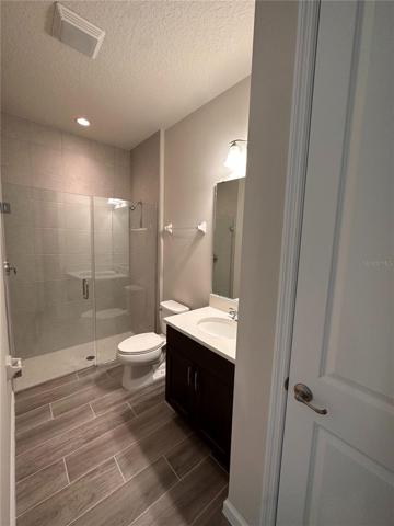 Walk in shower with frameless enclosure