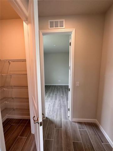 Kitchen leads to walk in closet and bonus room