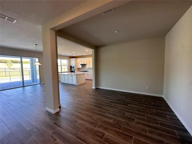 Upgraded wood plank tile throughout first floor living area