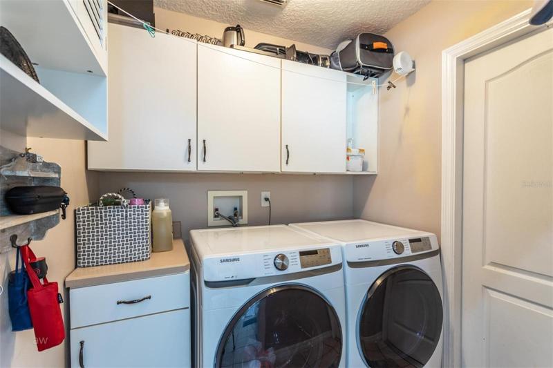 Laundry room with ample storage space.