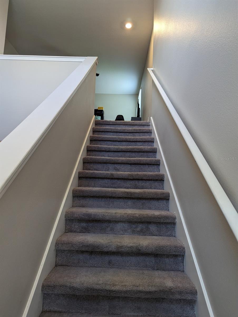 Stair case leading to the loft area and 4 additional bedrooms!