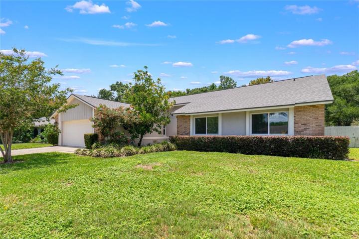 Completely **RENOVATED** Dr. Phillips **POOL HOME** with a bright **OPEN CONCEPT,** high ceilings, **NEW WINDOWS,** tile flooring throughout and a gorgeous **FIREPLACE** all on a large **.23 ACRE LOT!**