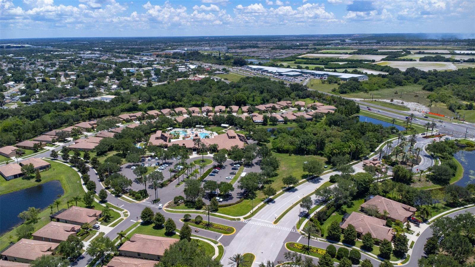 Clubhouse Facilities, Lots of Parking and View of the Guarded Gate Entrance  Beautiful Landscaping!