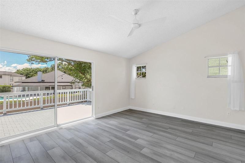 Master Bedroom with new sliding doors to upstairs Balcony.