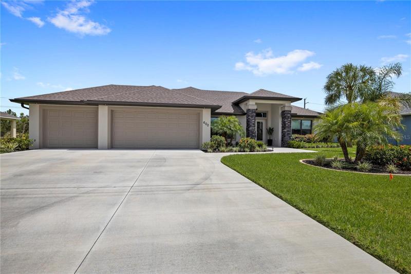 Front with three car garage