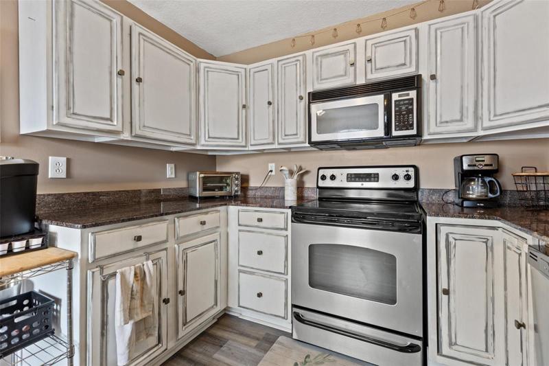 Spacious kitchen featuring granite counter tops and stainless steel appliances.