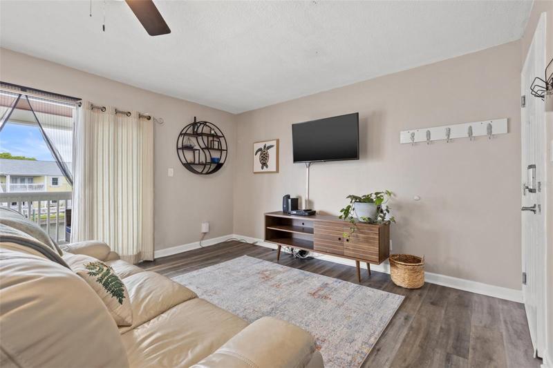 Living room leading to the waterfront balcony.