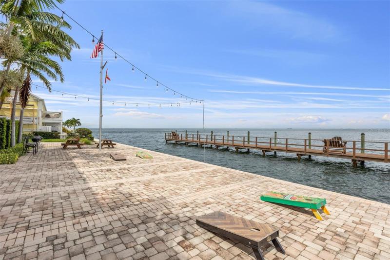 Community yacht club corn hole and docks.