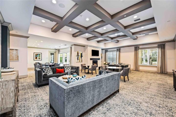 Spacious living room in the clubhouse. Play cards, do puzzles, read a book, watch TV or enjoy chatting with friends.
