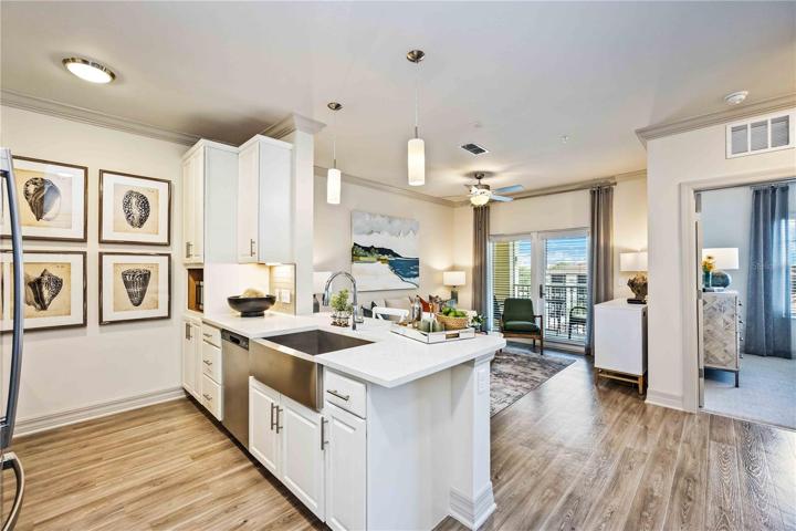 Farmhouse sink, stainless appliances, spacious living area and view of your private lanai