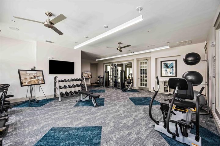 Cardio equipment and weights available. A yoga room is connected to fitness center