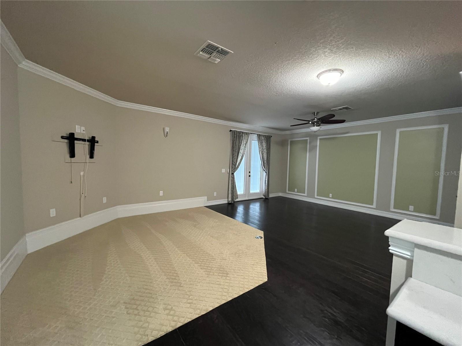 View of Bonus Room from the Bar with French Doors to the Balcony