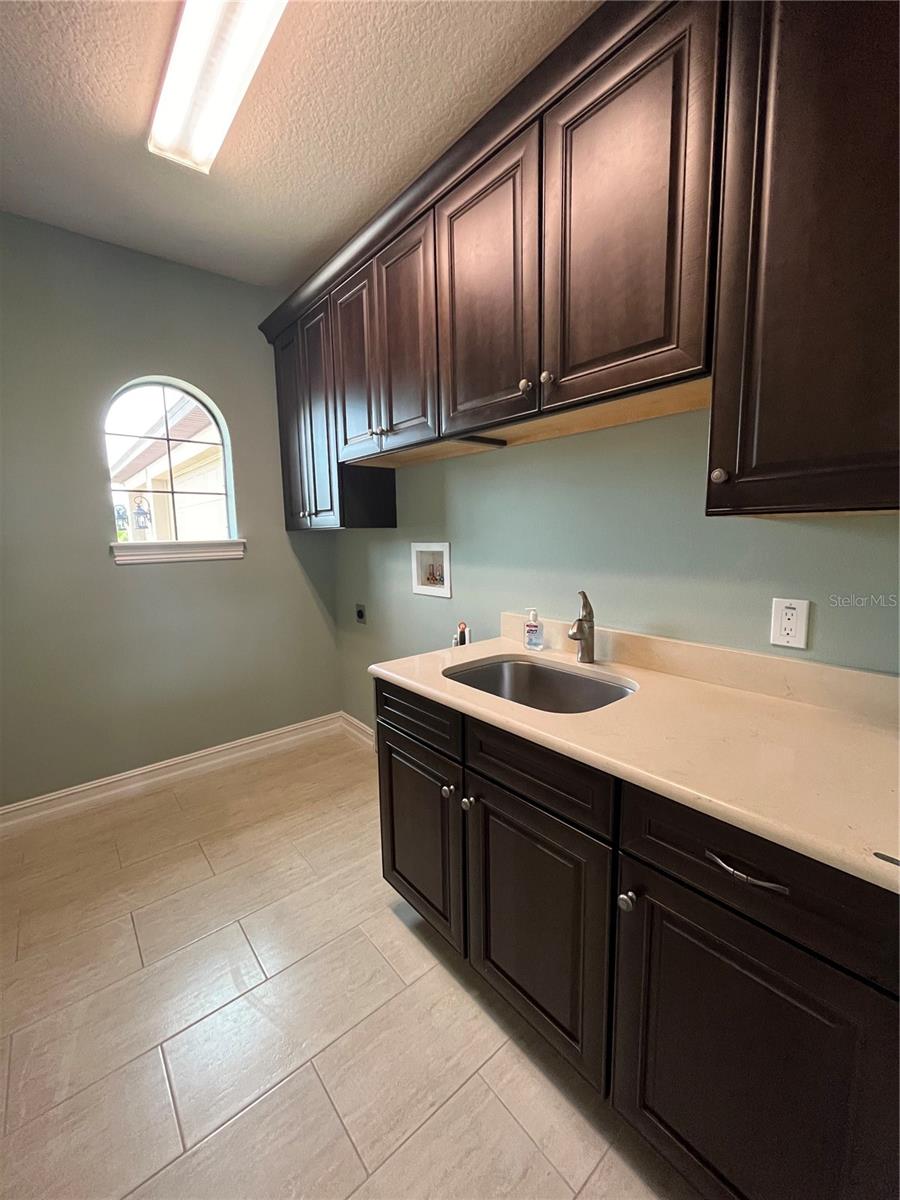 Indoor Laundry Room with Sink