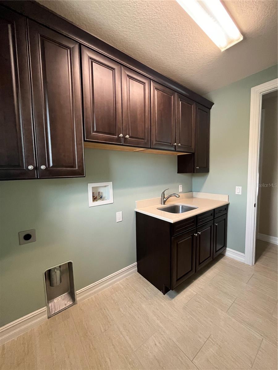 Laundry Room with Shelving and Caesar Stone Counters