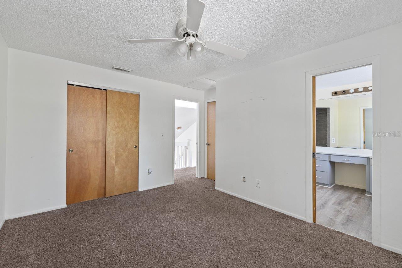 Left Unit: Guest bedroom #3 with a Jack and Jill bathroom and access to the shared balcony that overlooks the back yard.