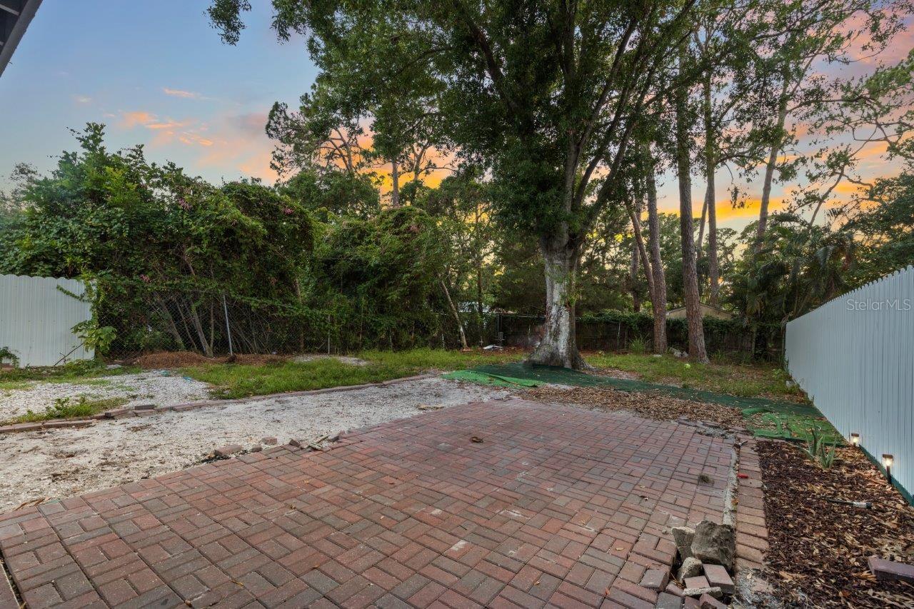 Left Unit: Large fenced in back yard with extended paver lanai.