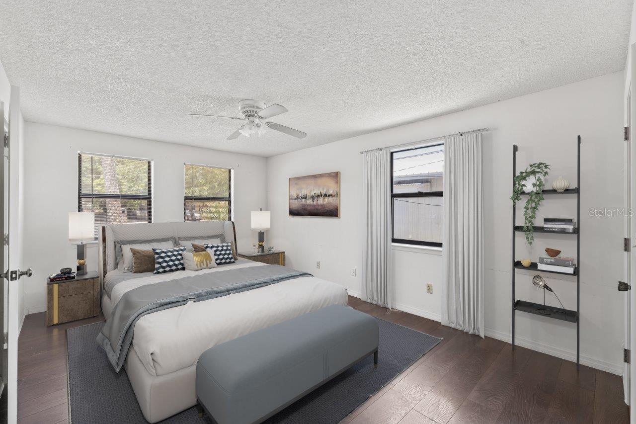 Left Unit: Owners suite featuring laminate flooring, walk-in closet, and en suite bathroom.