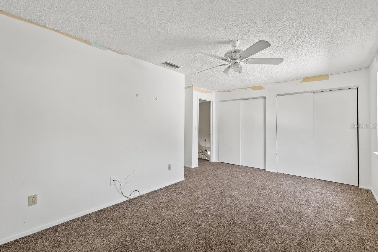Left Unit: Guest bedroom #2 with a Jack and Jill bathroom and access to the shared balcony that overlooks the back yard.