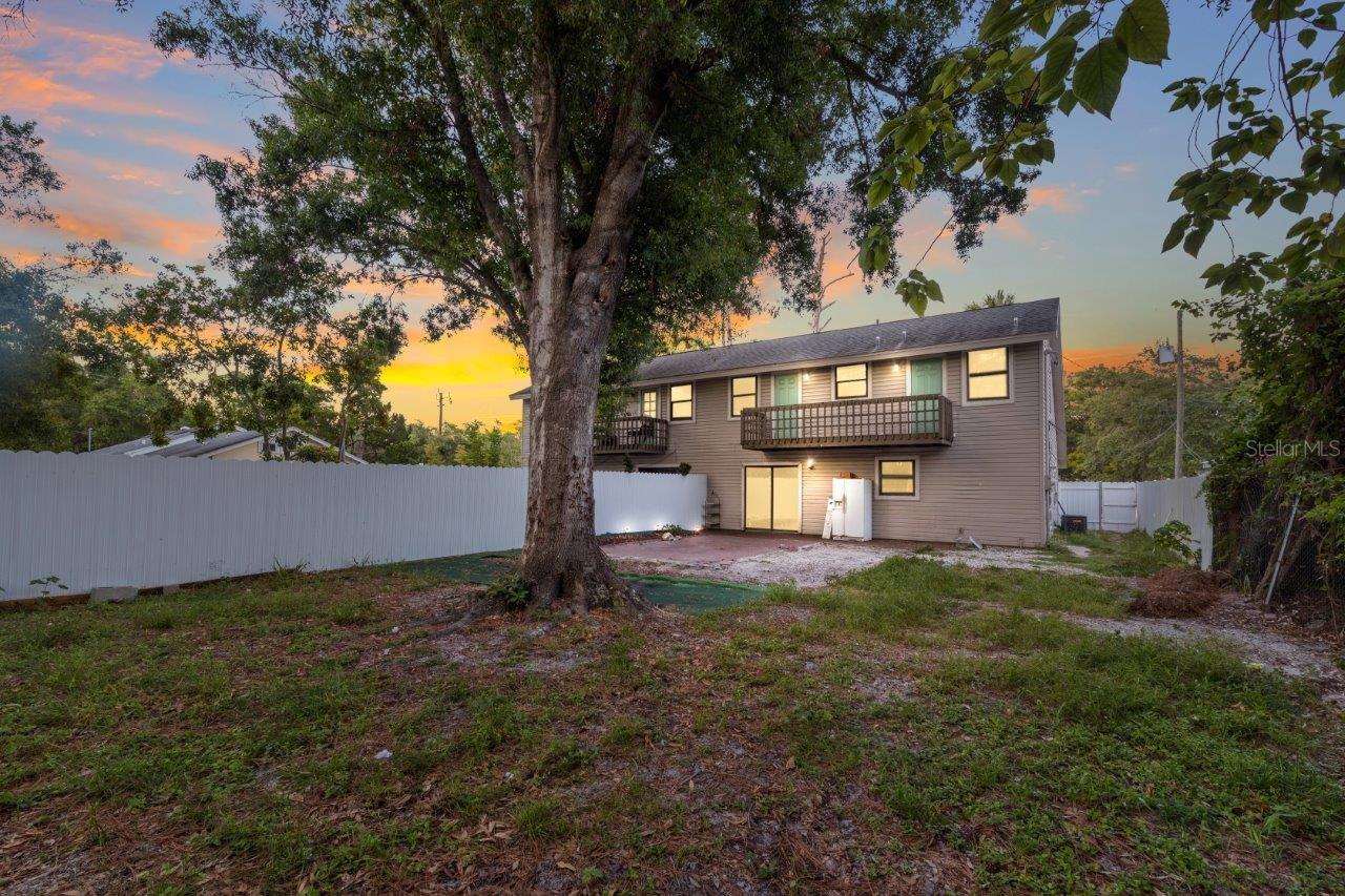 Left Unit: Large fenced in back yard with extended paver lanai.