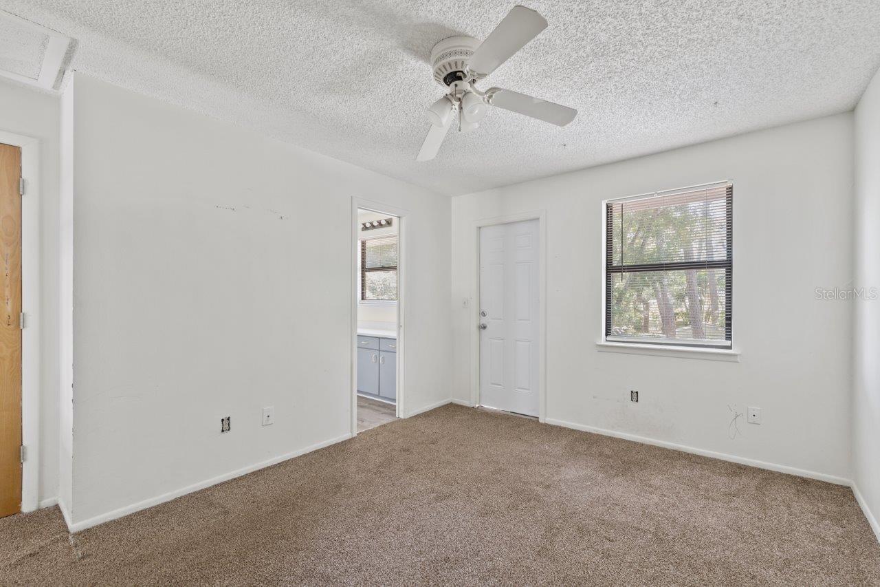 Left Unit: Guest bedroom #3 with a Jack and Jill bathroom and access to the shared balcony that overlooks the back yard.