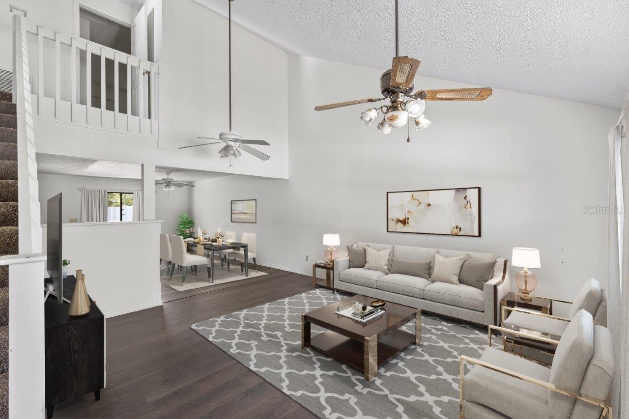 Left Unit: Open floorplan featuring cathedral ceilings up to the second floor, and laminate flooring throughout.