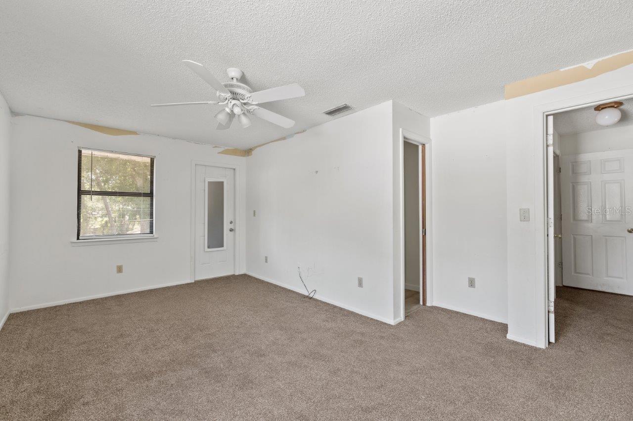 Left Unit: Guest bedroom #2 with a Jack and Jill bathroom and access to the shared balcony that overlooks the back yard.