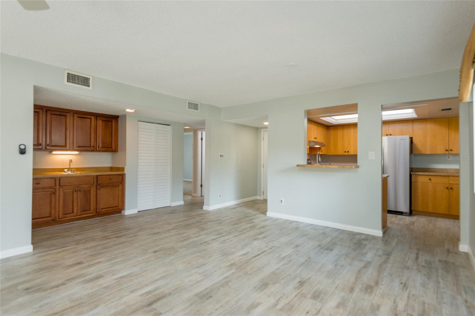 Wet Bar for entertaining or just putting your car keys.  Coat closet with new closet doors.
