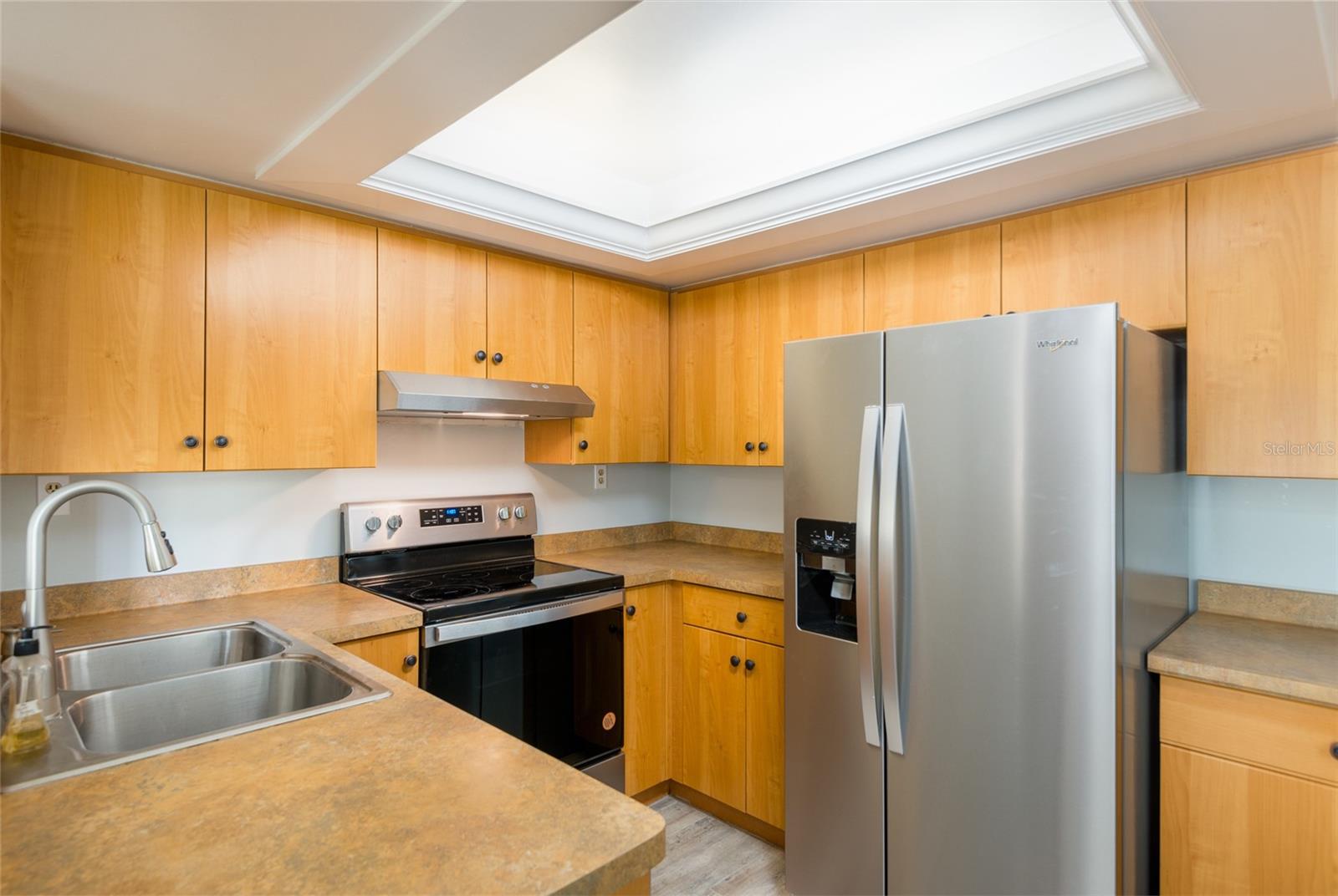Drop lighting removed in kitchen and custom lights built in.