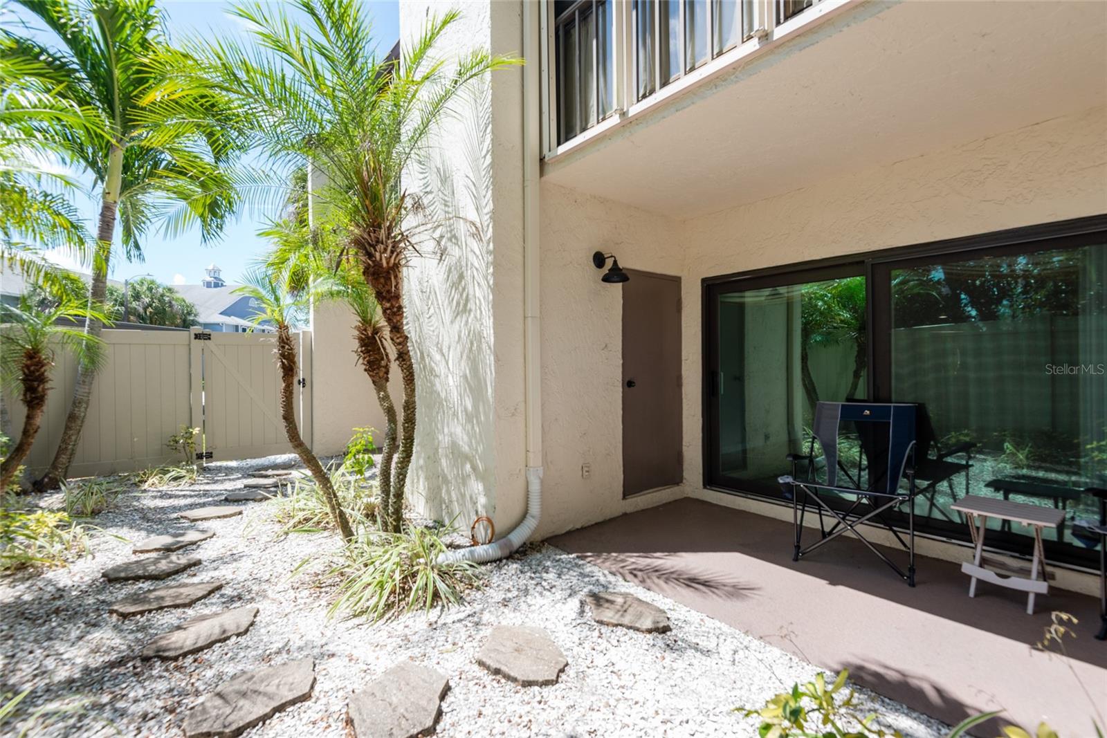 Rare private back yard fenced in courtyard.  (Because this unit was the model in 1979 the fenced in courtyard was grandfathered in)