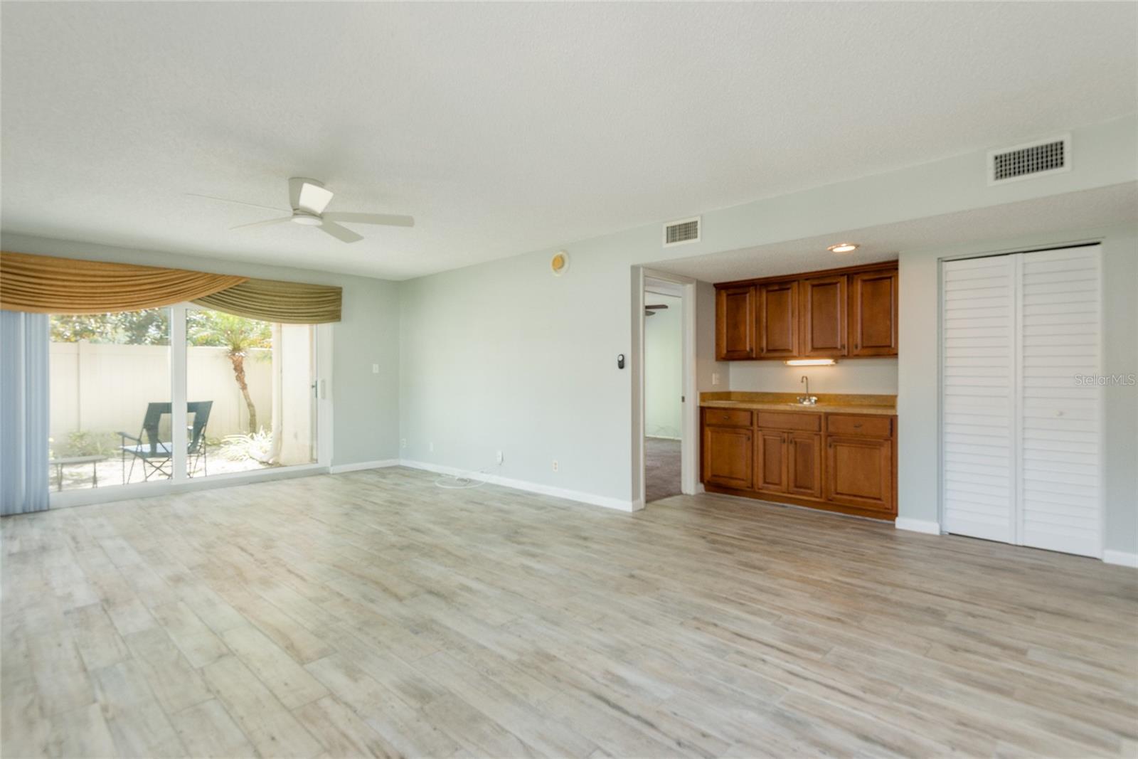 Wet bar leads into master bedroom.  New Ceiling Fan in living room.