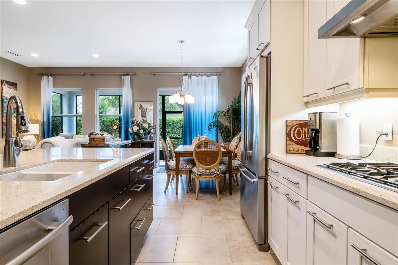 Kitchen area w/ natural gas cooktop, pot & pan drawers & pull-out shelving